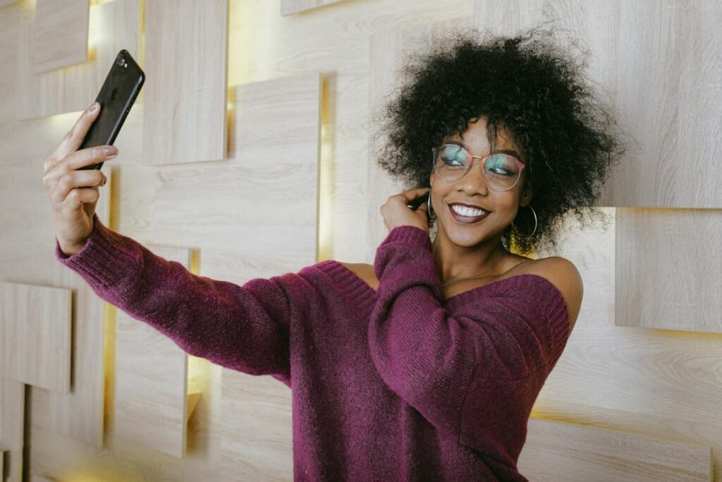 Woman In Sweater Wearing Eyeglasses